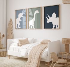 a bedroom with two dinosaur prints on the wall