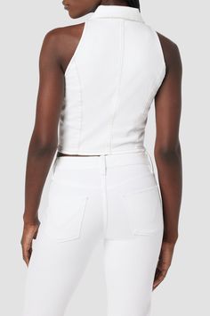 Description Our Halter Vest in White is a standout vest cut from premium comfort stretch denim with a pointed collar and button up front. Finished with contrast thread detailing. Product Details Body Length: 19.5", Chest: 32.25"Model Height 5'9"Model wearing size SMeasurements based on size S Fit & Care Content: 99% Cotton, 1% ElastaneMachine wash cold with like colorsDo not bleachTumble dry low or hang to dry White Stretch Denim Tops, Fitted Chic Denim Vest, Chic Fitted Denim Vest With Button Closure, Chic Fitted Denim Vest, Fitted Cropped Denim Vest With Button Closure, Chic Cropped Fitted Denim Vest, Chic Fitted Denim Vest For Spring, White Fitted Cotton Vest, White Fitted Denim Vest