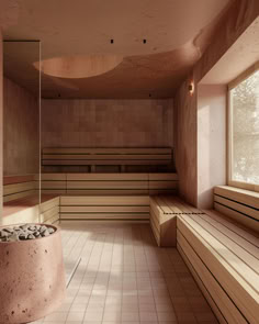 an empty sauna room with benches and mirrors on the wall, in front of a large window