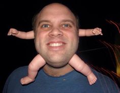 a man holding a baby up to his face with the caption's name underneath it