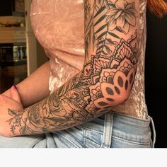 a woman with a tattoo on her arm