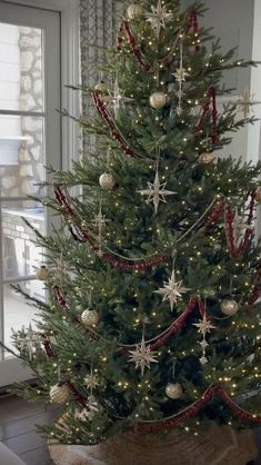 a decorated christmas tree in a living room