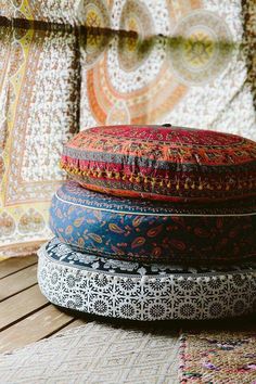 three round cushions stacked on top of each other