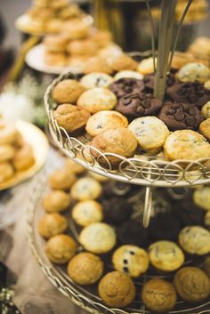 three tiered trays filled with different types of cookies