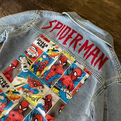 Looking for the perfect denim jacket? Look no further! Our Marvel Spider-Man Denim Jacket is the ultimate choice for any occasion, whether it's a night out or a casual day out. The wash off varies and unique fabric prints, these jackets are true to size and can also be worn as an oversized fit if you size up. For example, if your child wears a true size 3t, the 3t-4t option will fit perfectly oversized, but the 3t-4t size will also provide a perfect fit for regular wear. Say goodbye to uncomfort Spiderman Denim Jacket, Painting Ideas On Clothes, Spider Man Gifts, Unique Fabric Prints, Spiderman Jacket, Graphic Jacket, Estilo Hipster, Perfect Denim