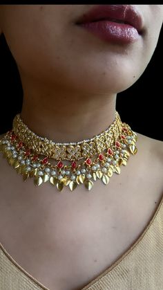 This papial patti set comes in a gorgeous beads and gold plating. The set is lightweight and can easily be worn separately for a lighter and simple look. The finishing is done in gold and is completely handmade with intricate work. Only one piece in stock! Set includes: Jhumka (Earrings), maang tikka, choker, Passa In stock and ready to ship… Luxury Kundan Meenakari Tikka, Luxury Meenakari Tikka For Celebration, Gold Kundan Metal Necklace For Celebration, Bohemian Gold Choker Bridal Necklace, Bohemian Gold Bridal Choker Necklace, Festive Gold Jewelry Sets, Gold Plated Kundan Necklace With Tilla For Ceremonial Events, Gold Kundan Necklace With Stone Work For Puja, Gold Kundan Bollywood Style Necklace