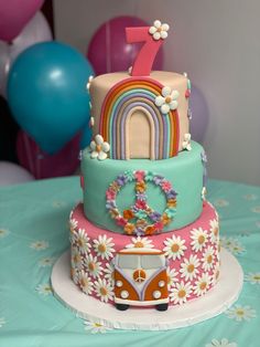 a birthday cake decorated with flowers and a vw bus