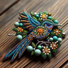 a bird brooch sitting on top of a wooden table