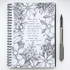 a notebook with a quote on it next to a marker and pen that says, there grows a flower in the plant that blooms