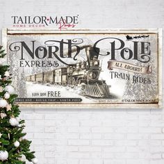 a christmas tree is next to a sign that says north pole express and train rides