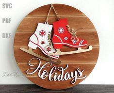 a wooden sign that says holidays and two snow boots