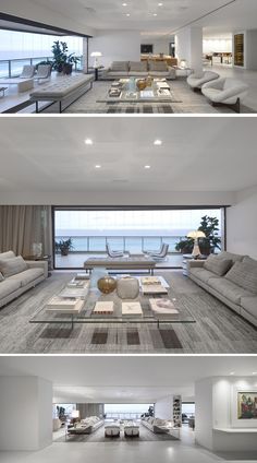 this modern living room has white couches and large windows that look out onto the ocean