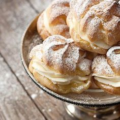 powdered sugar covered donuts on a plate