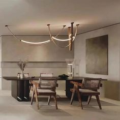 an elegant dining room with modern lighting fixtures