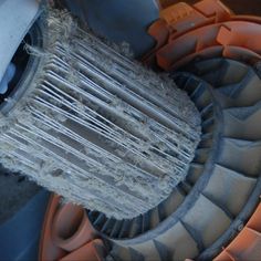 an old radiator sitting on top of a pile of dirt