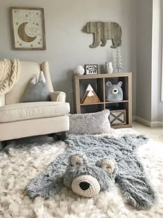 a teddy bear rug in the middle of a living room next to a chair and bookshelf