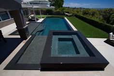 an outdoor swimming pool in the middle of a house