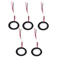 six black and white circles with wires attached to them