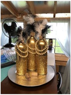 a gold crown sitting on top of a table next to a fan and other items