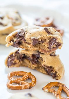 chocolate chip cookies and pretzels are stacked on top of each other with one cookie in the middle