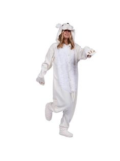 a woman in a white bunny costume is standing on one leg and smiling at the camera