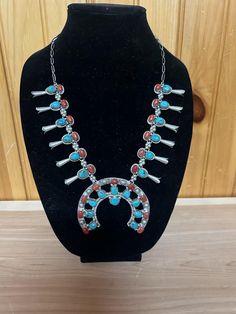 Outstanding 1960s squash blossom necklace. This piece is unsigned however it is sterling silver with lovely turquoise and coral. Truly amazing craftsmanship, made by Native Americans (Navajo). Turquoise And Coral, Squash Blossom Necklace, Squash Blossom, Dec 8, Southampton, Jewelry Necklace Pendant, Pendant Necklaces, 1960s, Blossom