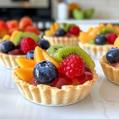 small fruit tarts on a white table