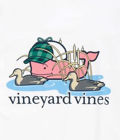 a t - shirt that says vineyard vines with a pink whale in the water and a green hat on its head