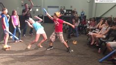 two children are dancing in front of an audience