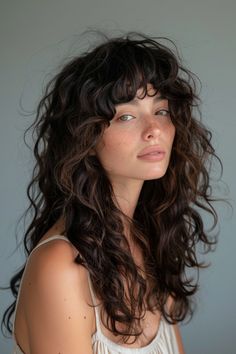 Are you ready to ditch the flat iron and embrace your naturally curly hair? Look no further than these 25 stunning layered curly haircuts that will make you fall in love with your unique texture. Haircuts For Slightly Curly Hair, Soft Shag Wavy Hair, Curls Bangs Long Hair, Long Hair Perm With Bangs, Medium 2c Haircut, Types Of Haircuts For Curly Hair, Curly Hair Butterfly Haircut, Fringe With Curly Hair, Shaggy Long Hair Curly