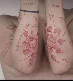 two women with tattoos on their arms and legs