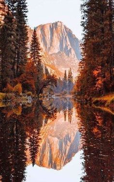 an image of a mountain reflection in the water