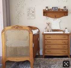 a baby's room with two cribs and a dresser