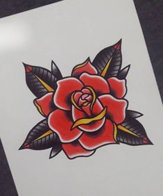 a red rose with black leaves on it's petals is shown in this tattoo design