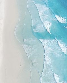 an aerial view of the beach and ocean