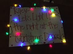 a sign with lights on it that says, riley lets light up the night at the christmas dance