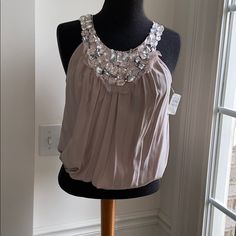 Beautiful Mauve Silk Sleeveless Pull Over Top. Clear Thins Stone Neckline Decor. Gathered & Stretchable Fitted Waistline. Easy To Coordinate. Brand New Condition. Featured By Cusp A Line From Neiman Marcus. Spring Season Sleeveless Blouse Halter Top For Evening, Spring Evening Sleeveless Halter Top, Glamorous Sleeveless Camisole For Spring, Glamorous Sleeveless Summer Blouse, Spring Evening Tank Top, Feminine Evening Tank Top For Spring, Feminine Spring Evening Tank Top, Feminine Sleeveless Camisole For Party, Spring Sleeveless Evening Camisole