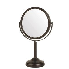 a round mirror sitting on top of a metal stand in front of a white background