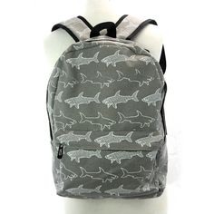 Wherever you go, do it in shark style with this grey canvas backpack that looks like it's infested with sharks. This fun backpack featuring an all-over shark print is versatile and functional and you can carry almost anything around, wherever you go. The zippered pouch on the front and an open pocket on either side give you a little extra space to stash and store your stuff. The inside is fully lined and has a lightly padded open compartment to fit a small laptop or electronic device or hold you Fun Backpack, Shark Print, Small Laptop, Small Book, White Sharks, Zippered Pouch, Cool Backpacks, Canvas Backpack, Hold You