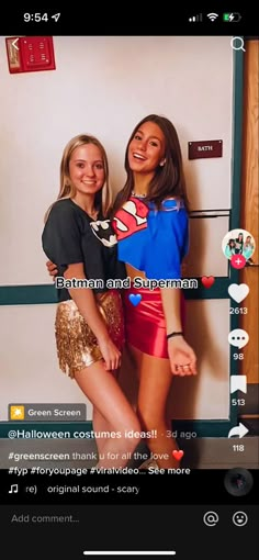 two girls standing next to each other in front of a wall