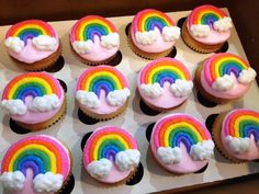 cupcakes with rainbow frosting and clouds on top