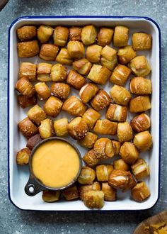 roasted potatoes and dipping sauce in a white dish