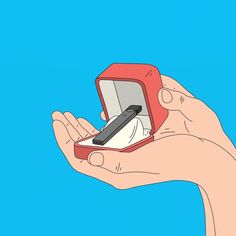 a hand holding an electronic device in it's red case on a blue background