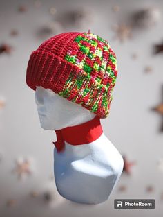 Crocheted hat with a flip brim. Multi-color, mostly red. Bells attached to top. Superwash Merino wool. Warm and stretchy. Red Brimmed Mini Hat, One Size Fits Most, Red Brimmed Mini Hat, Warm Red Winter Hat, Adjustable Brimmed Red Crochet Hat, Multicolor Flat Brim Winter Hat, Red Adjustable Christmas Hat, Adjustable Red Christmas Hat, Red Crochet Hat With Adjustable Short Brim, Adjustable Red Hats For Holiday