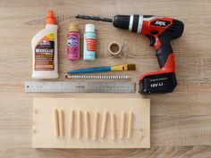 the tools needed to make this diy woodworking project are laid out on a table