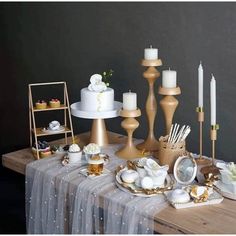 a table topped with lots of different types of cakes