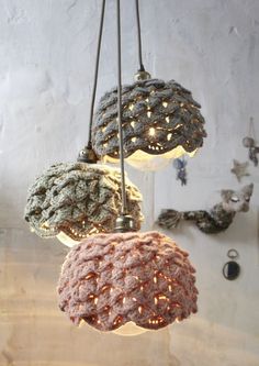 three lights that are hanging from the ceiling