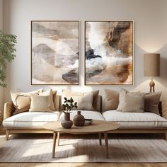 a living room with two paintings on the wall and a coffee table in front of it