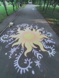 the sidewalk is painted with white and yellow chalk