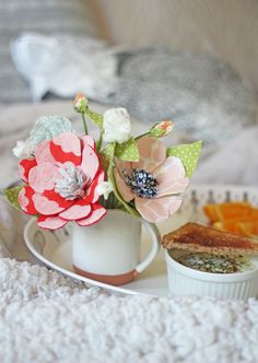 a tray with food and flowers on it